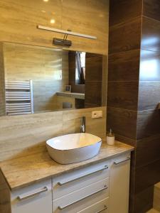 a bathroom with a sink and a mirror at AsPa in Ostrowo +96 photos