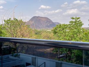 a view of a mountain from a balcony at The Lusso Hotel in Abuja