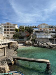 a bridge over a body of water with buildings at Duo Apartments in Bar
