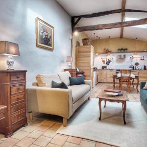 a living room with a couch and a table at Repos à Ribérac B&B in Ribérac