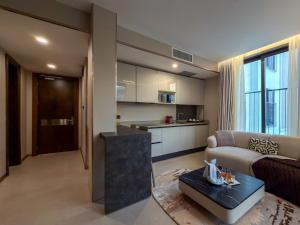 a living room with a couch and a table at The Lusso Hotel in Abuja