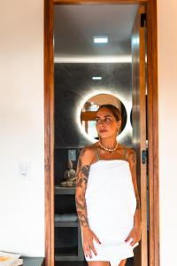 a woman wearing a hat and a white dress at Bali Andino Vilas in Ciudad Lujan de Cuyo +136 photos