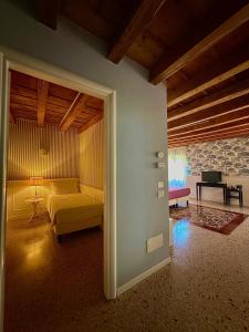 a bedroom with a bed and a couch in a room at All'Opera Prima in Verona +24 photos