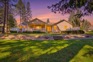 a house with a lawn in front of it at The Fairway To Heaven in Rathdrum