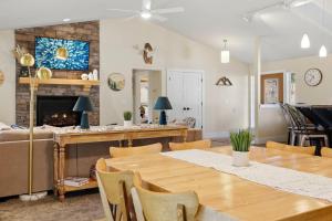 a living room with a table and a fireplace at The Fairway To Heaven in Rathdrum