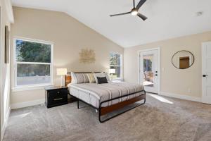 a bedroom with a bed and a ceiling fan at The Fairway To Heaven in Rathdrum +43 photos