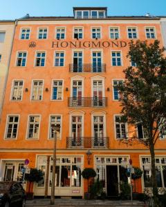 a large orange building with a sign on it at Honigmond Boutique Hotel in Berlin