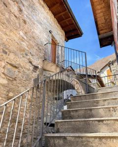a set of stairs leading up to a building at Rustico Maria Full House Lake View Escape in Vercana