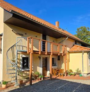 a house with a staircase on the side of it at Auszeit Posthausen in Machern +34 photos