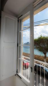 a window with a view of the ocean at Sea Balcony House in Senglea
