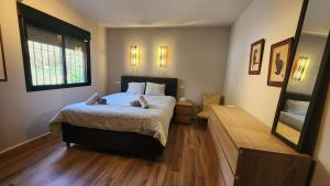 a bedroom with a bed with two teddy bears on it at Chalet a 500m del mar in Altea +25 photos