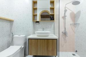 a bathroom with a sink and a toilet and a shower at Artsy Boutique Studio in Hanoi +102 photos