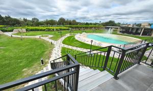 a balcony with a view of a swimming pool at Lagoon Miramar in Miramar