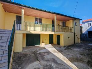 an apartment building with a balcony and a parking lot at Malhadinhas House in Vila Nova de Paiva