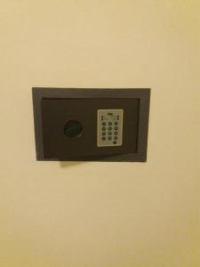 a switch on a wall with a remote control at Verde Mare "Appartamenti Per Vacanze" in Tortoreto Lido