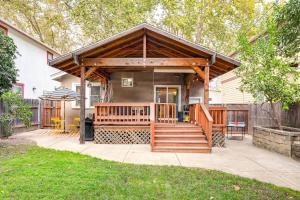 a house with a porch with a wooden deck at Midtown Oasis - BBQ, Deck, Games & Artistic Vibes in Sacramento