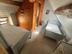 an overhead view of a bedroom with a bed and a table at Gîte des sabotiers in Le Boissenet