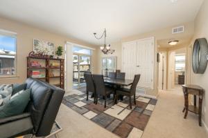 a dining room and living room with a table and chairs at 175 Spinner 5-2 in Fraser