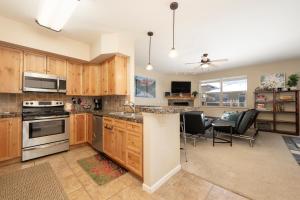 a large kitchen with wooden cabinets and a dining room at 175 Spinner 5-2 in Fraser