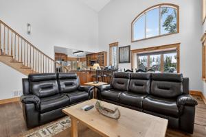 a living room with two leather chairs and a table at 21 GCR 4435 in Grand Lake