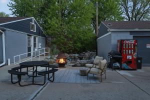 a patio with a coke machine and a table and chairs at Explore Indy in Perfect Location - Cozy 1BR in Indianapolis