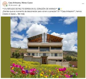 a picture of a building in a field with flowers at Casa Artesana Maras URU CUZ PE in Maras