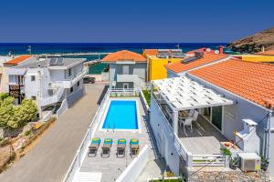 an aerial view of a house with a swimming pool at Villa Areva by Villa Plus in Panormos Rethymno