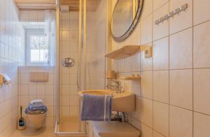 a bathroom with a sink and a shower at Haus Wörle- Ferienwohnung "Hahle" in Musau +12 photos