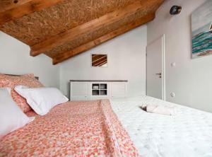 a bedroom with a large bed with white walls at La Felicita in Gornji Zemunik +63 photos