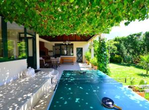 a swimming pool in the backyard of a house at Villa Nature Retreat in Gruda