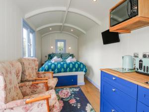 a bedroom with a bed and a tv in a room at Skye in Ludlow