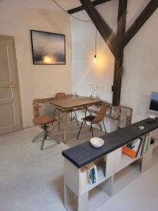 a dining room with a wooden table and chairs at Kranich in Ueckermünde