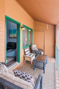 a porch with couches and a table on a house at 643 Silvercreek Inn Condo in Granby