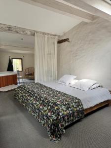 a bedroom with a large bed in a room at Domaine de Ribaute in Lieuran-lès-Béziers +69 photos