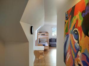 a living room with a painting on the wall at Olsson B&B in Randers +71 photos