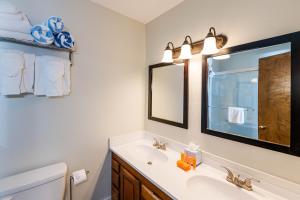 a bathroom with a sink and a mirror at 645 Silvercreek Inn Room in Granby