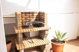 a wooden bird house sitting on a wooden bench at Yesenia Vv Airport in El Matorral