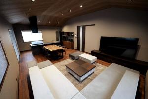 a large living room with a flat screen tv at 龍宿 Noboru Yado in Kagoshima