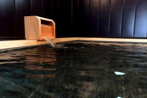 a pool of water with a water pump in a swimming pool at 龍宿 Noboru Yado in Kagoshima