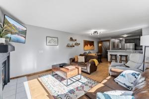 a living room with a couch and a table at 820 Badger Ln in Fraser