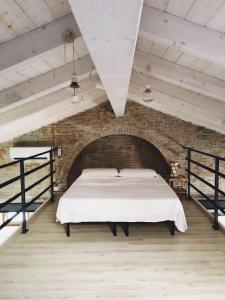 Ein Bett oder Betten in einem Zimmer der Unterkunft Casa Vacanza Piazza Gramsci 1