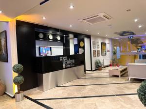 a lobby of a building with a tv on the wall at Trakya City Hotel in Edirne
