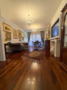a living room with a couch and a fireplace at Al Colosseo Quadrato in Rome
