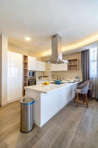 a kitchen with a large white island in a room at A Scenic Escape within Nairobi in Nairobi