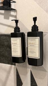 two bottles of soap sitting on top of a counter at Kotraba Alacati Hotel in Alaçatı