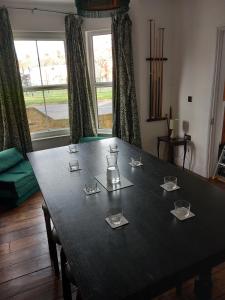 a table with a tea kettle on top of it at Mill Villa Pakefield in Pakefield