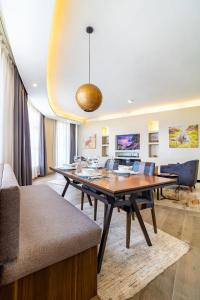 a dining room with a large wooden table and chairs at A Scenic Escape within Nairobi in Nairobi +22 photos