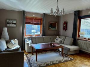 a living room with a couch and a coffee table at Nordic character in Vidsel
