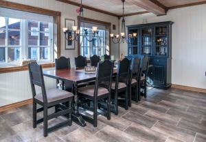 a dining room with a table and chairs at Rauland, Listaullii in Torvetjørn +10 photos