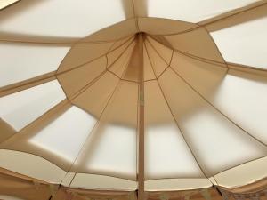 a ceiling of a room with a large umbrella at Shepherds Belle & Croft Hut - Qu7633 in Messing +13 photos